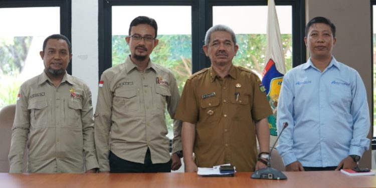 Asisten II Setda Kota Palu Membuka Sosialisasi Bela Pengadaan dan Mbizmarket