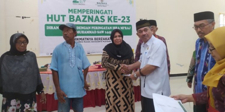 Asisten II Setda Kota Palu Hadiri Peringatan HUT Ke-23 Baznas Kota Palu, Bagikan 100 Paket Bantuan